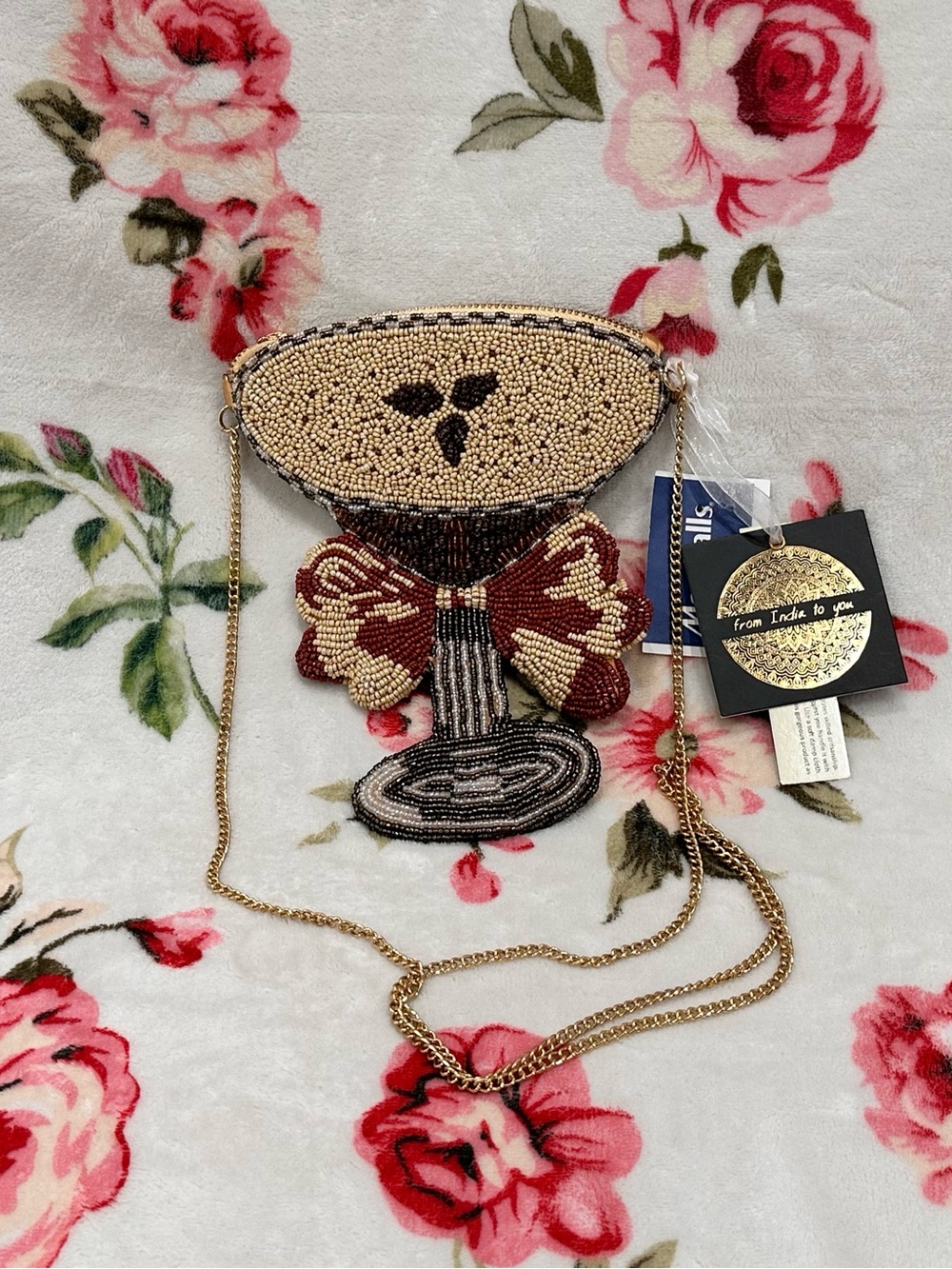Beaded espresso martini cocktail glass crossbody bag with a red bow detail